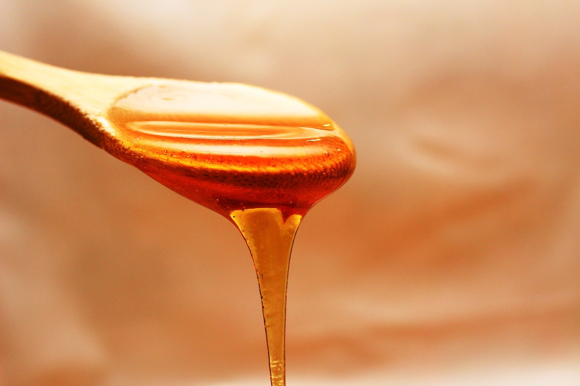 honey dripping off a spoon